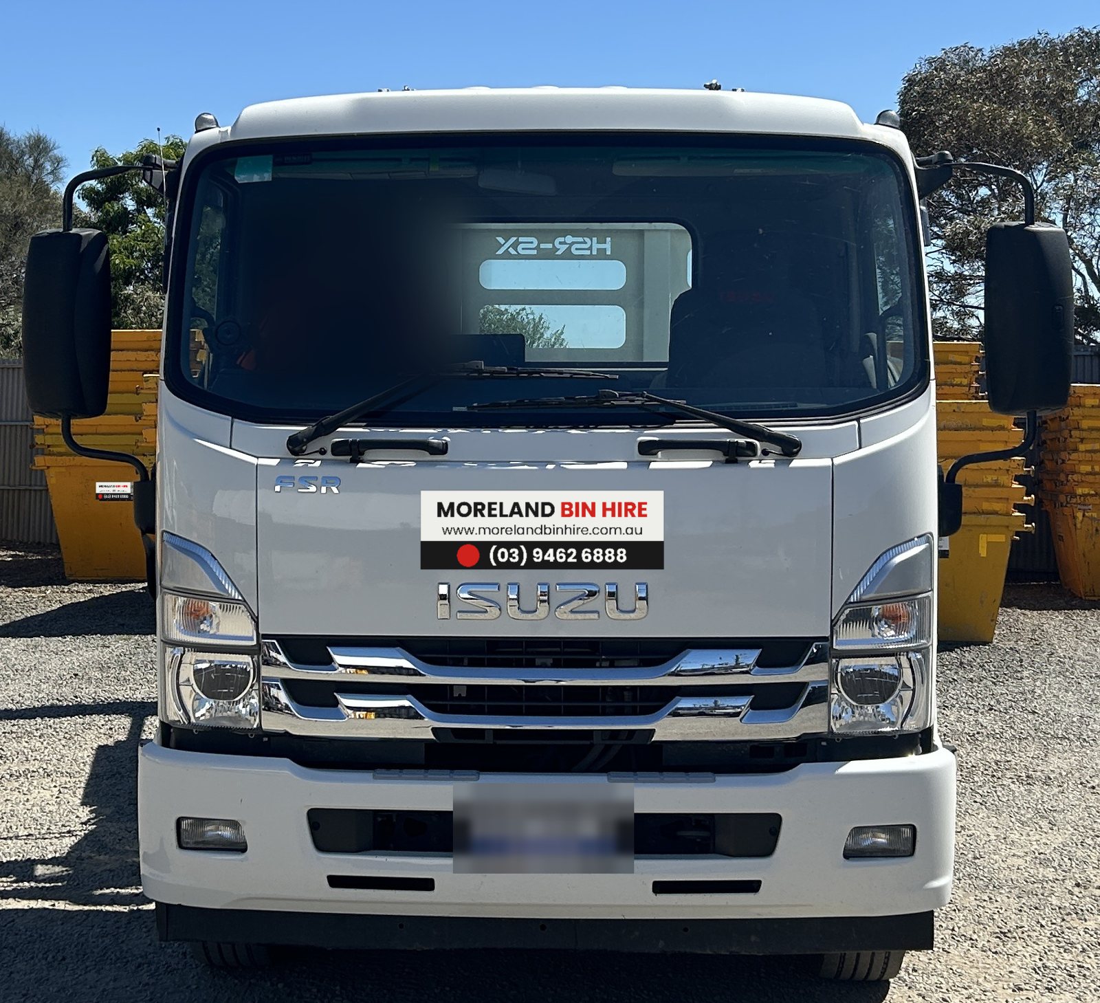 Isuzu FSR small skip truck, front view